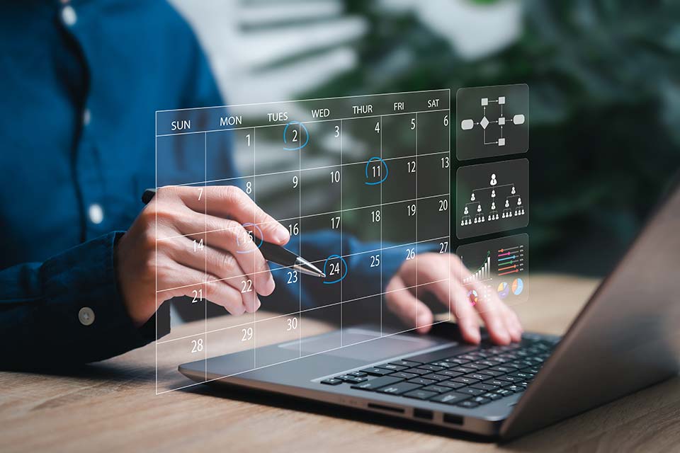 man working on laptop, calendar graphic